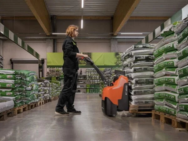 Photo of an Operator Using BT Levio Powered Pallet Trucks