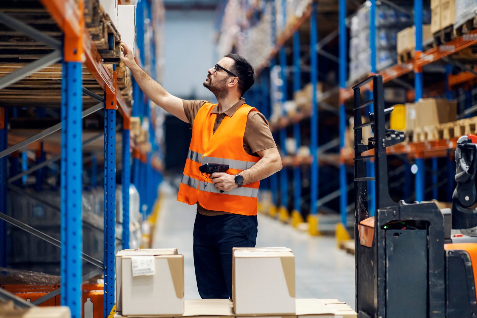 A,Supervisor,With,Scanner,In,Hands,Checking,On,Goods,In Warehouse Scanner